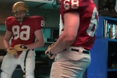 fine 10-Pounder stroking in football gear